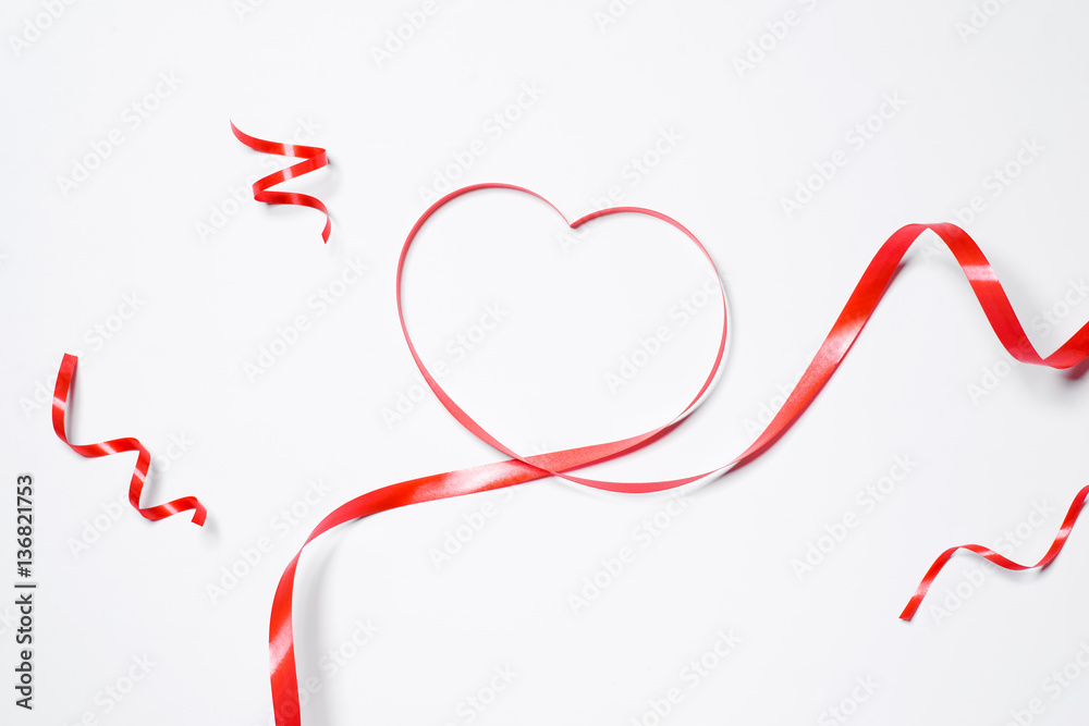 Festive red ribbon isolated on white background Festive red ribbon isolated on white background