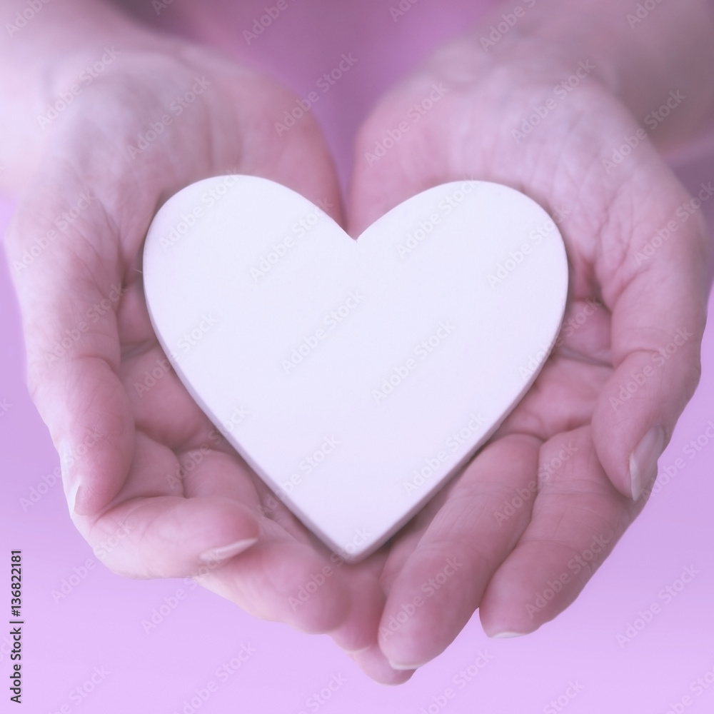 womans hands showing a white heart womans hands showing a white heart