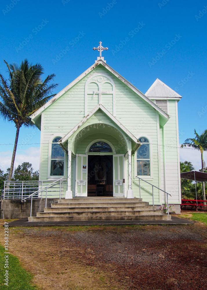 A quaint green historic painted church, the Star of the Sea, near Hilo on Hawaii's Big Island.