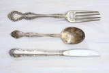 Vintage cutlery on rustic white board