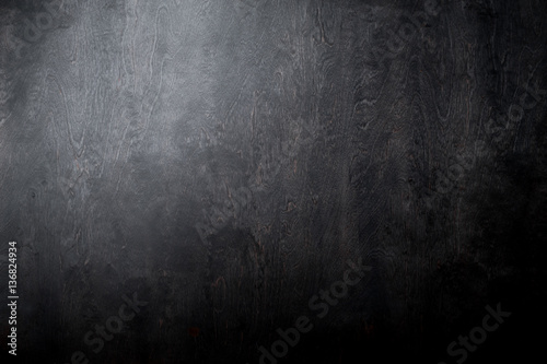 Simple black wooden background texture with light and dark