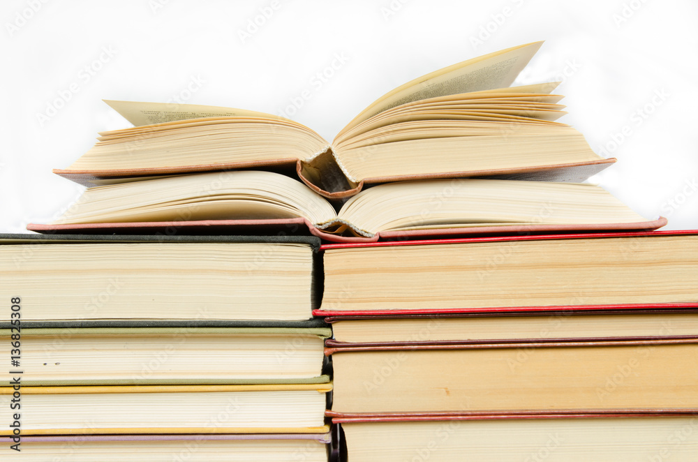 a stack of colorful books in a library or a room a stack of colorful books in a library or a room