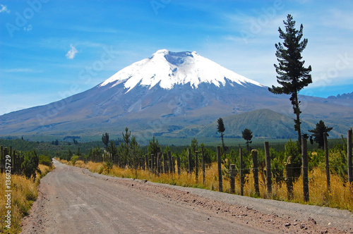 Dirt road that leads to the majestic Cotopaxi (the highest active volcano in the world), in the heart of the Andes, Ecuador, South America. photo