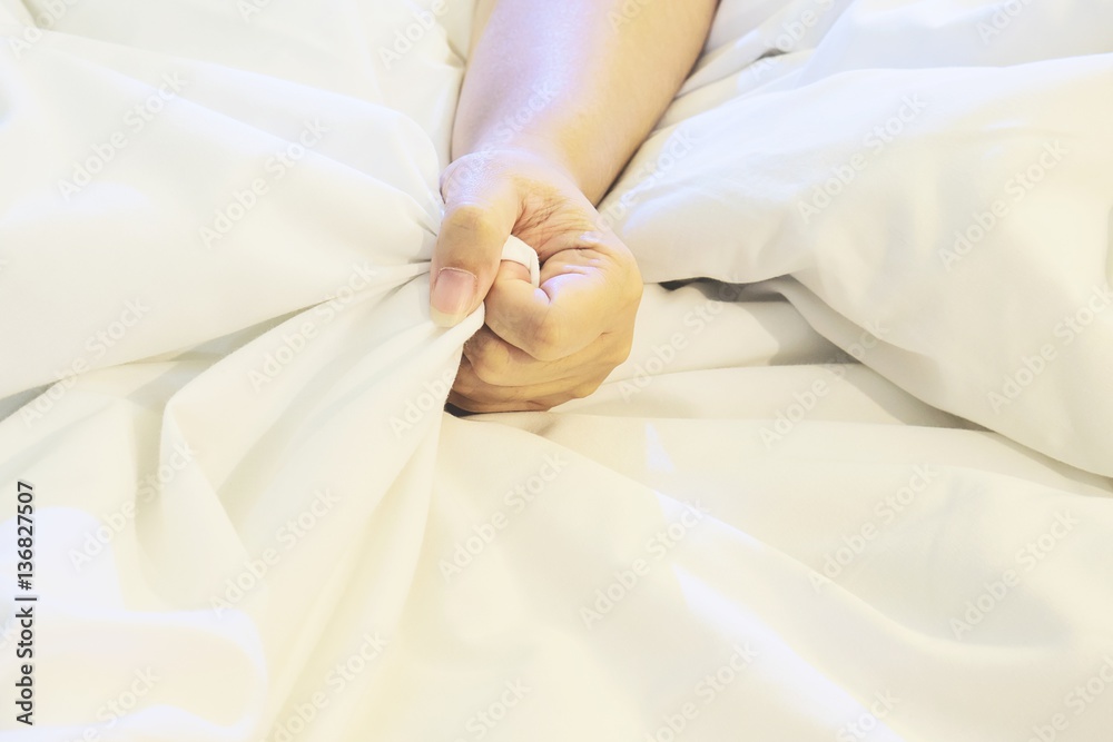 Woman hand holding bed sheet fabric tightly, sexual concept Stock Photo Adobe Stock