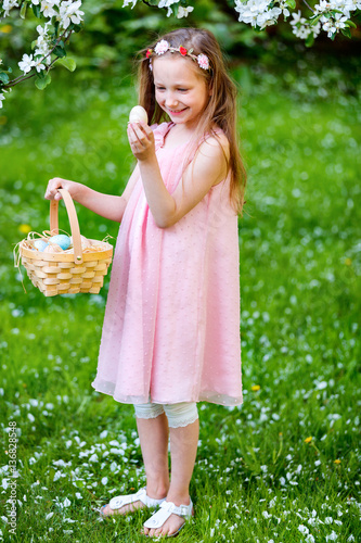 Little girl playing with Easter eggs