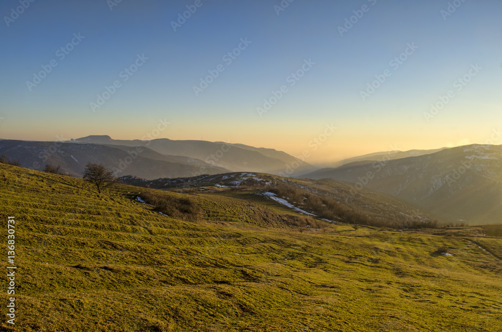 Beautiful landscape in the mountains with the sun at dawn. Mountains at the sunset time. Azerbaijan, Big Caucasus