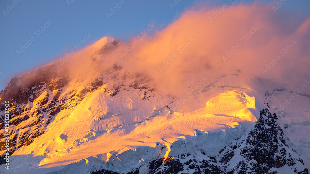 Landscape detail of glacier in colorful golden sunset, NZ