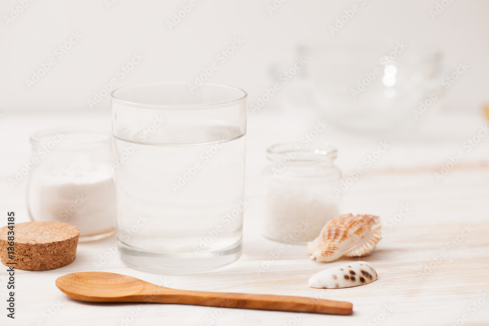 sea salt, starch in the jar and wooden spoon for recipes of cosm sea salt, starch in the jar and wooden spoon for recipes of cosm