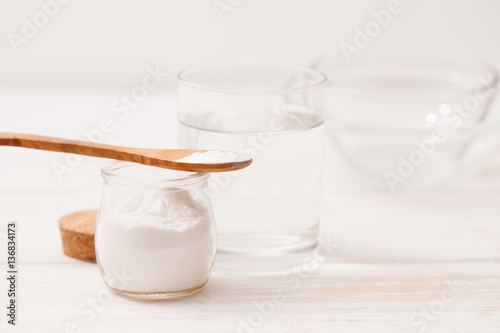 sea salt, starch in the jar and wooden spoon for recipes of cosm