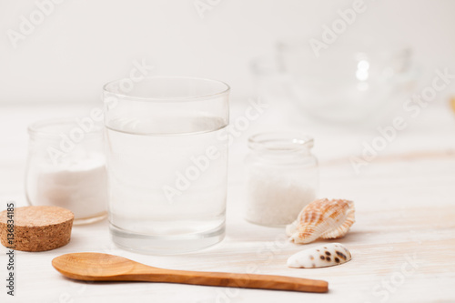 sea salt, starch in the jar and wooden spoon for recipes of cosm