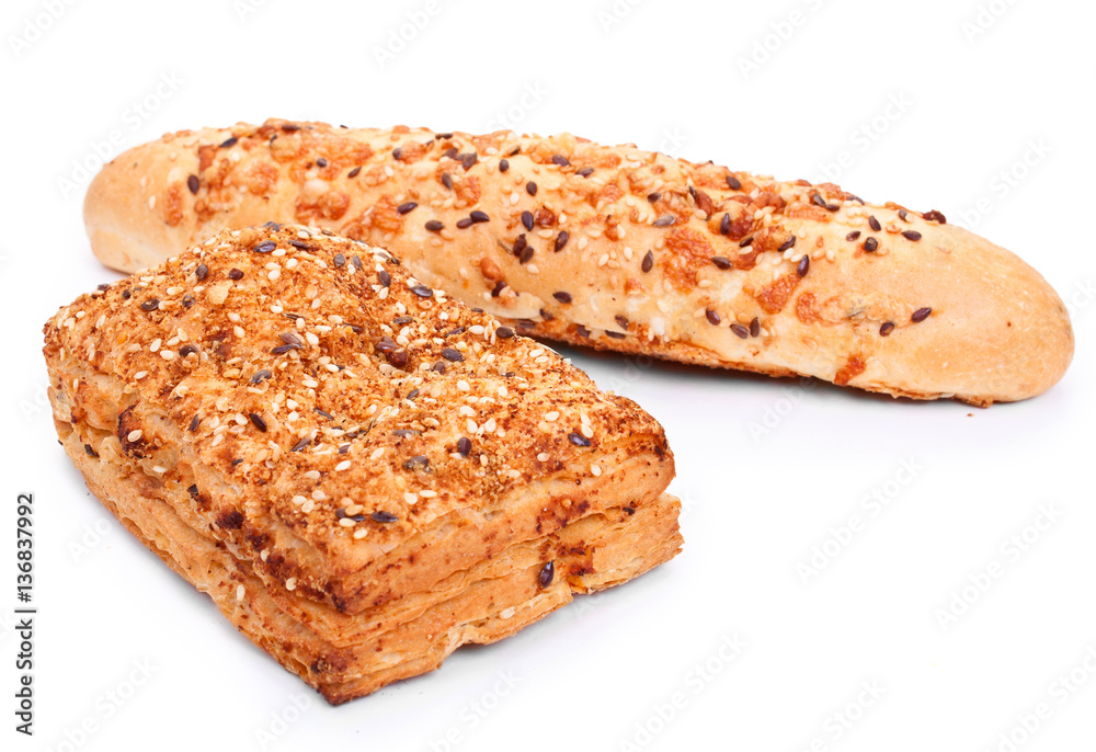 Pair of spicy bun sprinkled with sesame seeds isolated on white