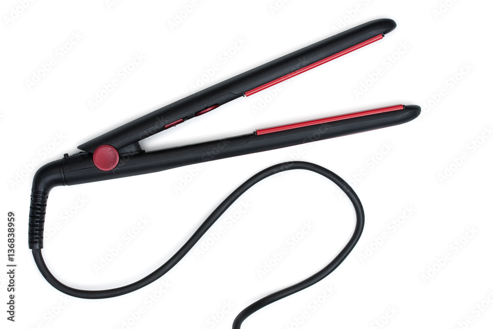 Electric curling iron with ceramic plates isolated on white back Electric curling iron with ceramic plates isolated on white back