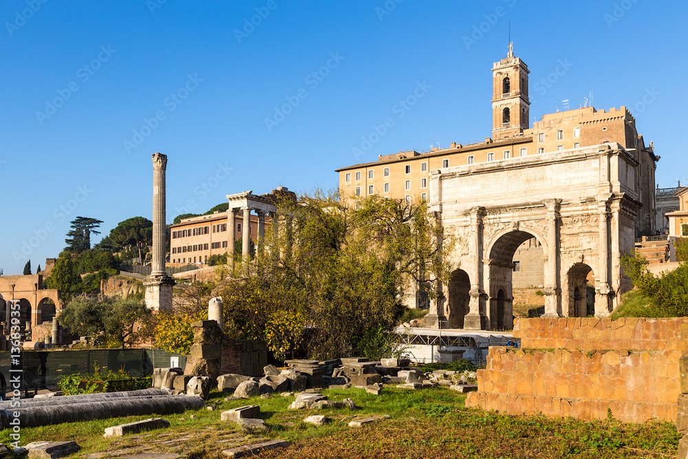 Rome, Italy. Roman Forum: Column of Phocas (608) and the ruins of the portico of the Temple of Saturn, 489 BC, Arch of Septimius Severus, 205
