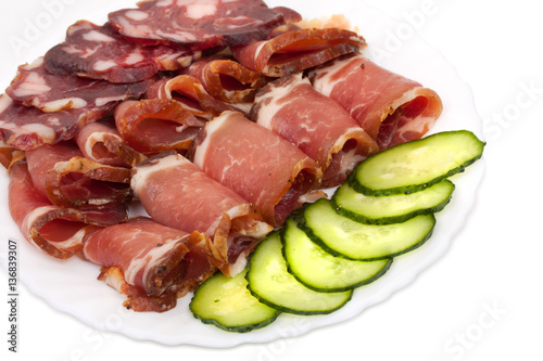 Sliced homemade dry sausages and meat products, cured meat, baco