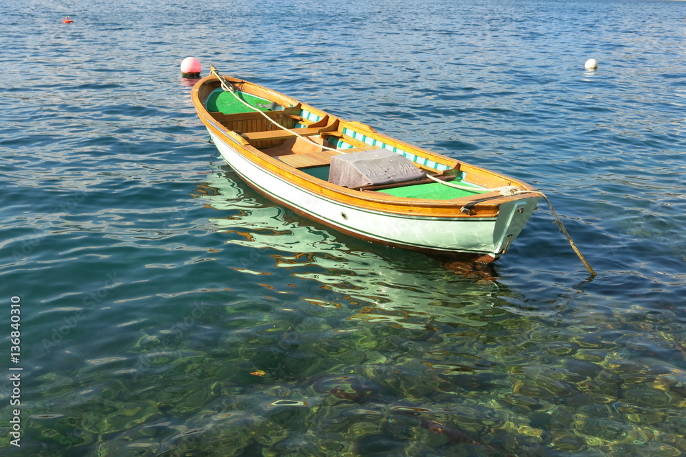 A boat. Calm sea.