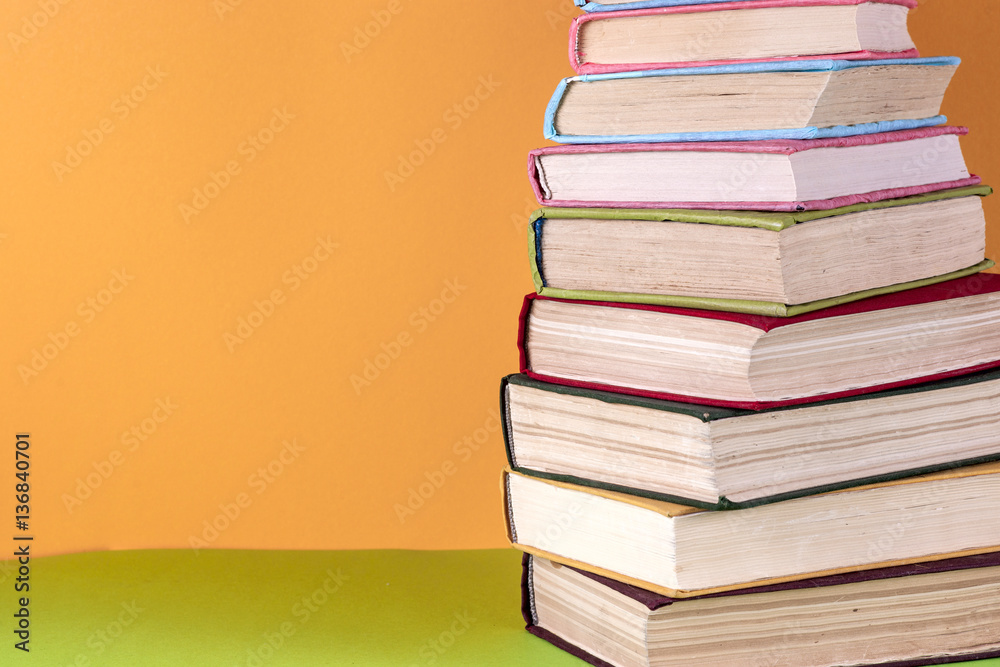 Old books on a wooden shelf. No labels, blank spine. Old books on a wooden shelf. No labels, blank spine.