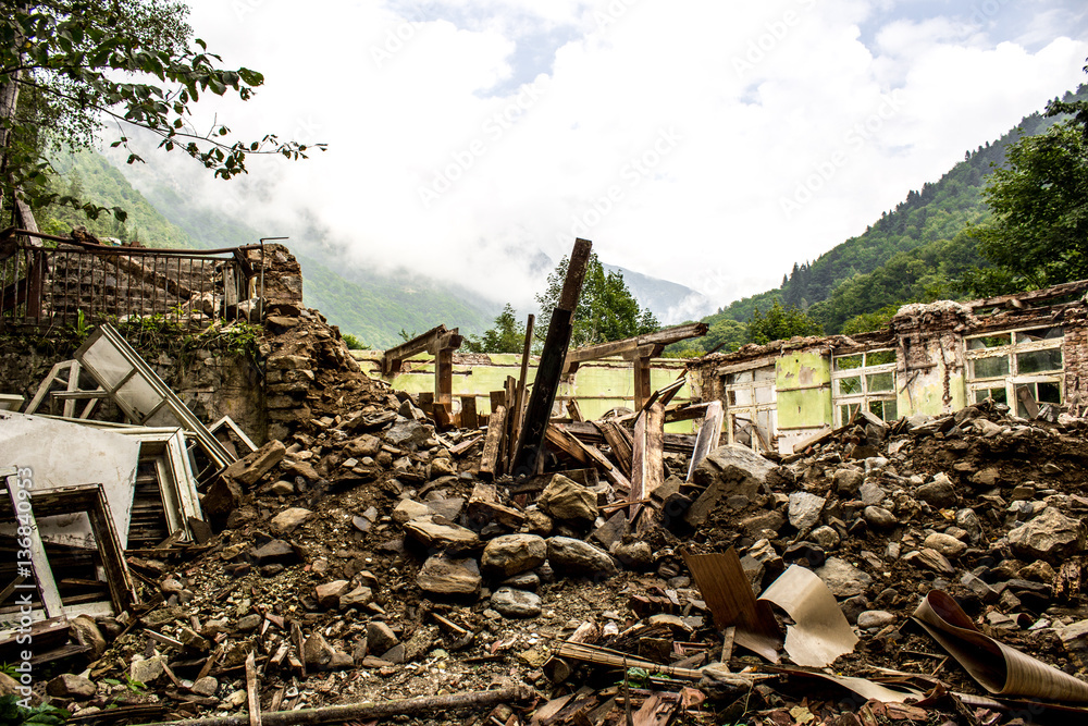Destroyed building with a mountain view
