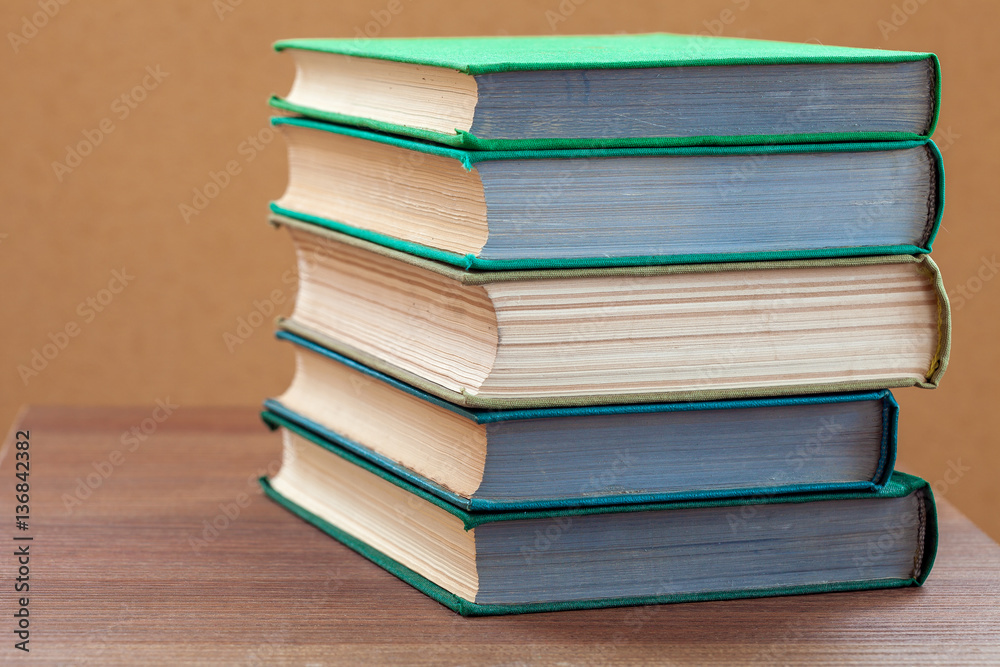 books on a wooden table. books on a wooden table.