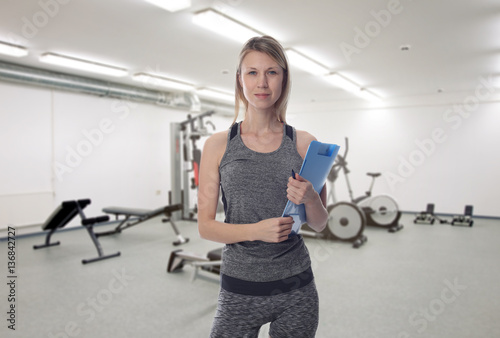 Female Fitness trainer at gym. Working out, Sport ,Healthy life style concept.