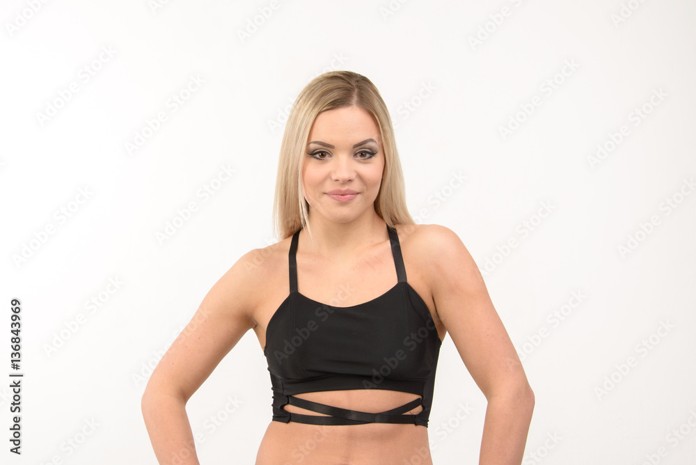 Beautiful sports blonde sexy girl on a white background Beautiful sports blonde sexy girl on a white background