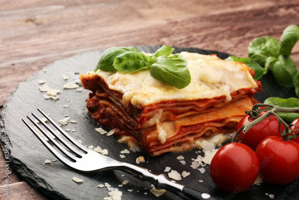 Serving of spicy traditional Italian beef lasagne in a restauran Serving of spicy traditional Italian beef lasagne in a restauran