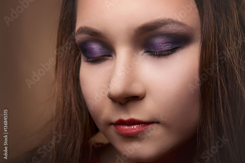 Close-up portrait of girl with professional makeup