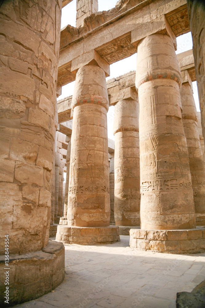 big stone columns with carving figures and hieroglyphs in landmark Egyptian Karnak Temple, public ancient monument declared a World Heritage by Unesco, in Luxor, Egypt, Africa
big stone columns with carving figures and hieroglyphs in landmark Egyptian Karnak Temple, public ancient monument declared a World Heritage by Unesco, in Luxor, Egypt, Africa