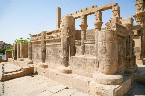 stone carved colonnade in landmark Philae Temple, Egyptian public monument for the goddess Isis, declared World Heritage Unesco, in Egypt, Africa 