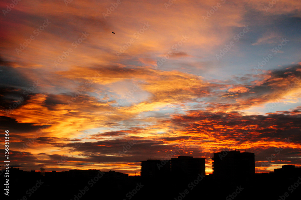 beautiful amazing view at sun rising over city buildings in summ beautiful amazing view at sun rising over city buildings in summ