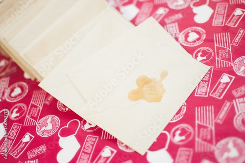 Wallpaper Mural Beige envelopes with the stamp on a red background Torontodigital.ca