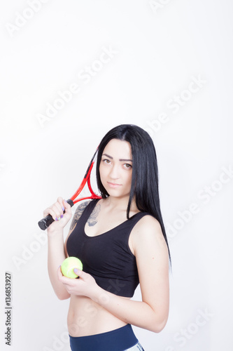 Sport woman with a tennis racket and ball