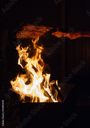 Fire burns, meat in the dark prepares