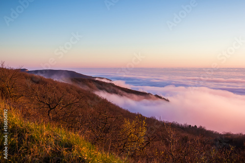 Beautiful sunset with clouds and mountains. Sunset colors