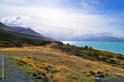 Mount Cook viewpoint with the lake Pukaki and road leading to mount cook village