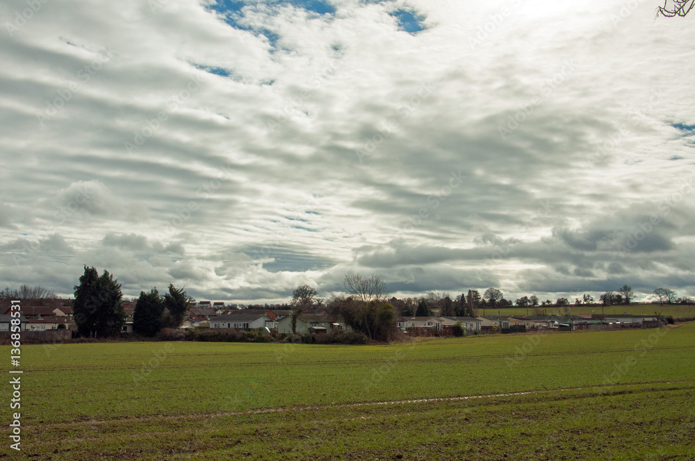 Stratocumulus clouds in the English countryside. Stratocumulus clouds in the English countryside.