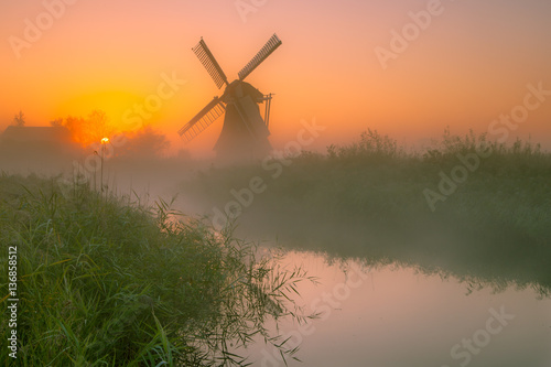 Dutch Windmill in a wet polder
