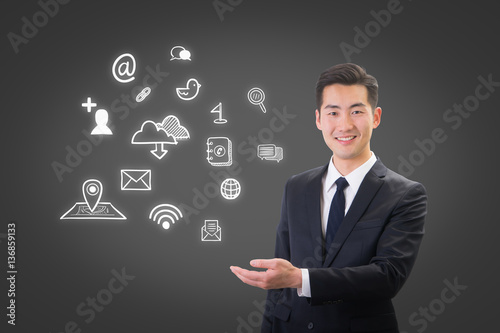 Young businessman showing social media & Internet icon concept