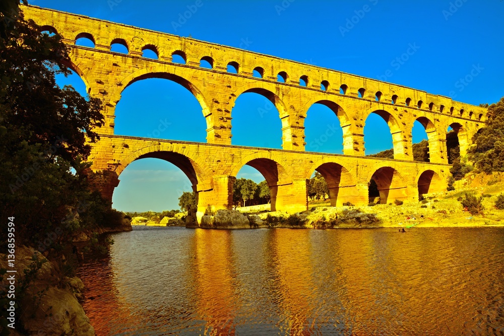 The three-tiered aqueduct of Pont du Gard in France.