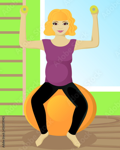 Pregnant woman on fitball in gym