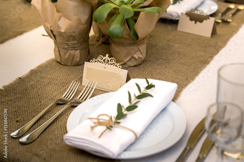 Wedding table setting in rustic style. Eco style. Wedding decoration. Table setting with a sign for the label.