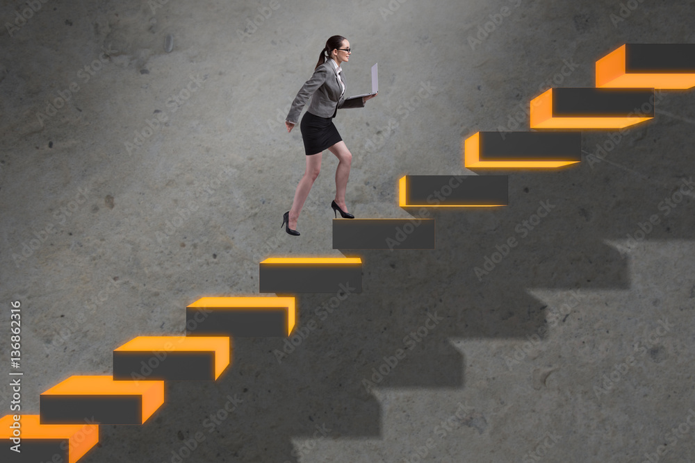 Young businesswoman climbing career ladder Young businesswoman climbing career ladder