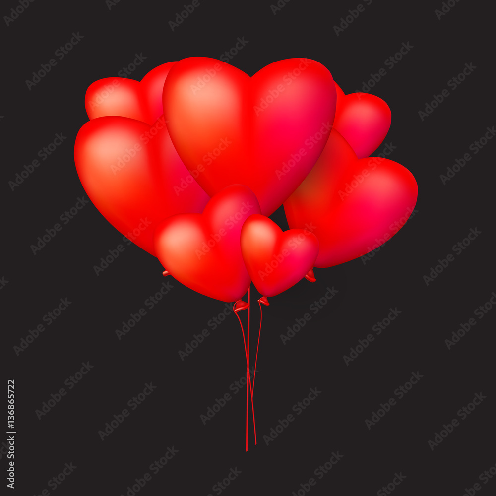 Red heart balloons on a  black