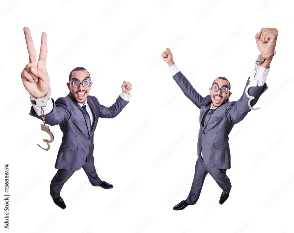 Funny businessman with handcuffs on white Funny businessman with handcuffs on white