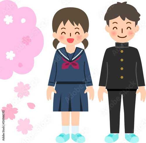 制服を着た笑顔の男女と桜