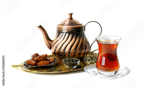 Turkish tea in traditional glass and metal teapot isolated on white