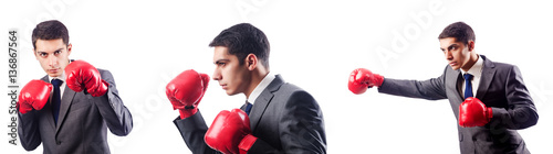 Businessman with boxing gloves on white © Elnur