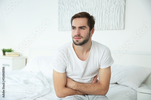 Handsome man feeling stomac...