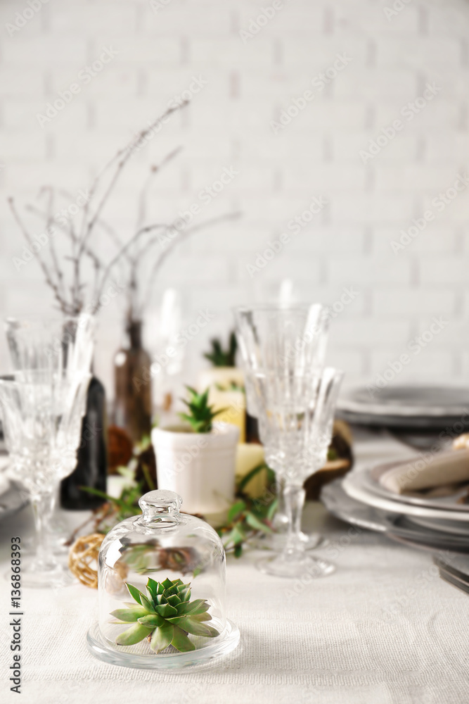 Table served with succulents for dinner in living room Table served with succulents for dinner in living room