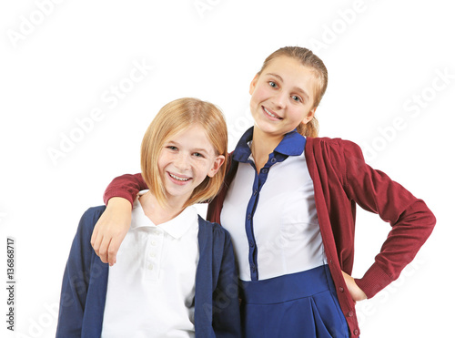 Two cute girls in school un...