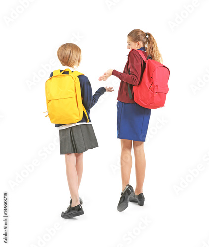 Two cute girls in school un...